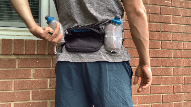 The Nathan Sports Trailmix Plus 3.0 running belt with water bottles.