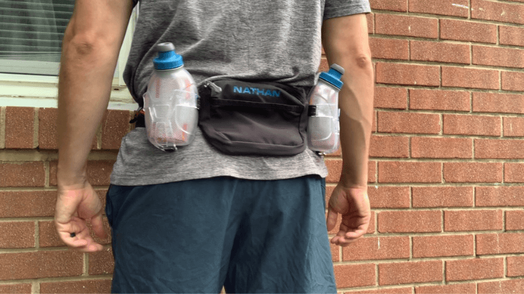 The Nathan Sports Trailmix Plus 3.0 running belt with water bottles.