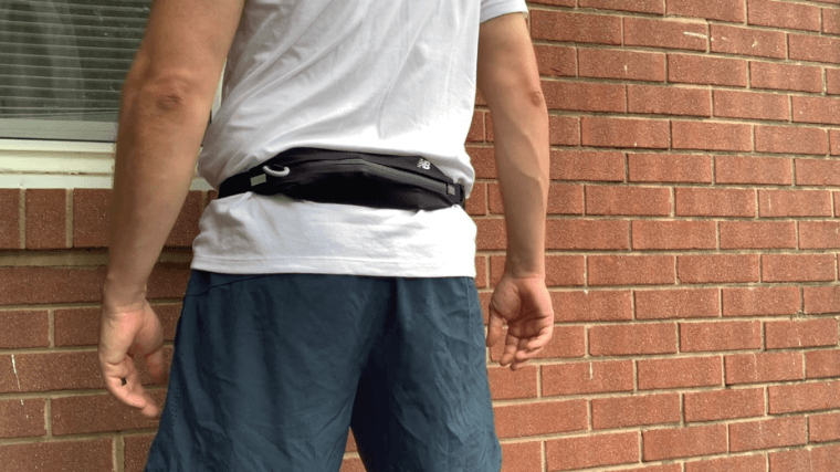 A runner wearing the New Balance Running Stretch Belt.