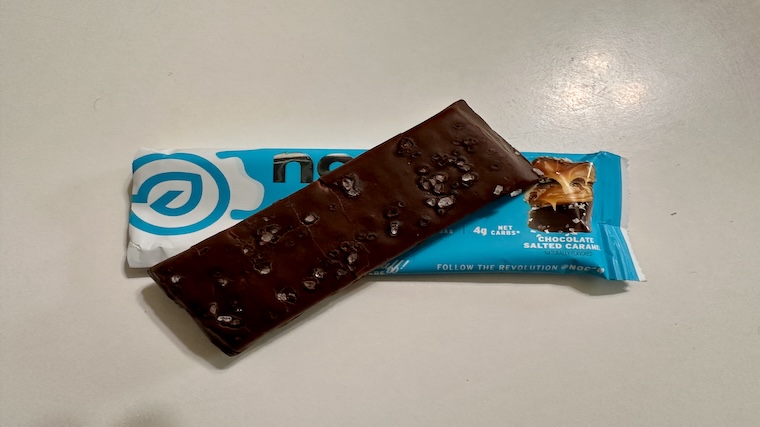 An unwrapped No Cow Dipped Protein Bar