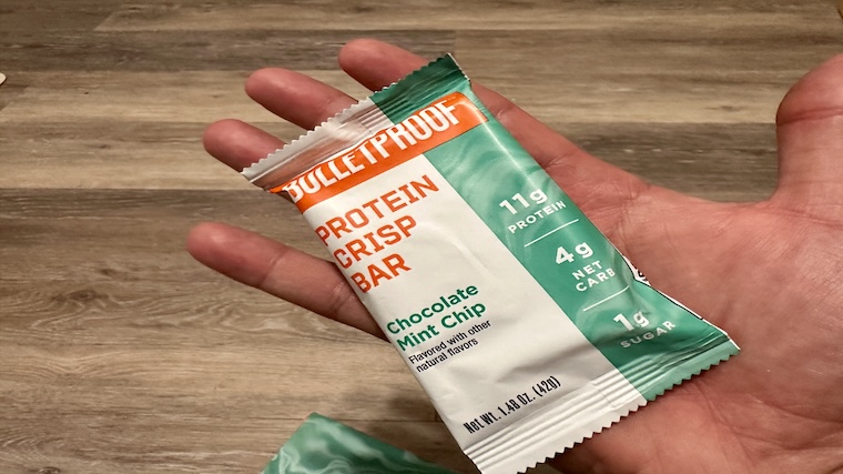 Our tester holds a chocolate mint chip Bulletproof Protein Crisp Bar