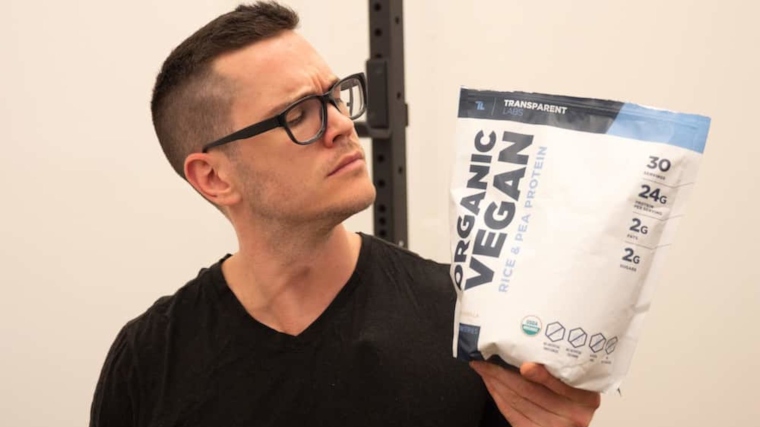 Our tester inspects a bag of Transparent Labs Vegan Rice and Pea Protein