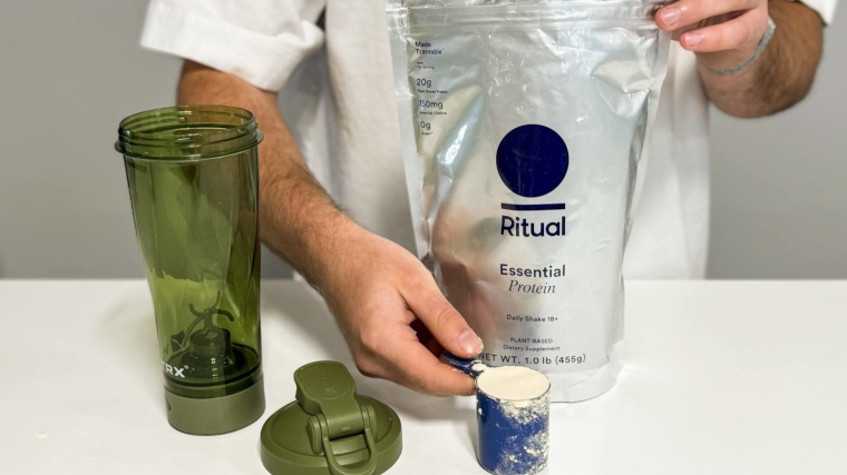 Our tester poses while making a shake with Ritual Essential Protein Daily Shake 18+ Protein Powder