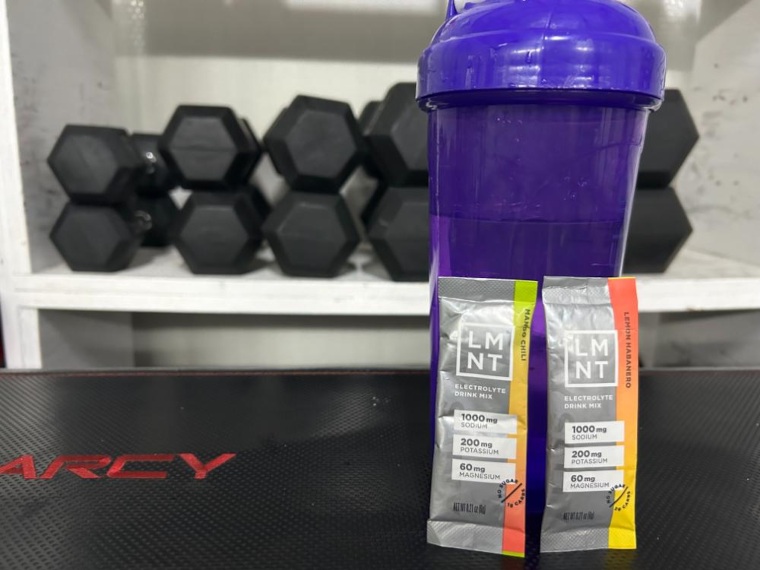 Packets of LMNT in a home gym