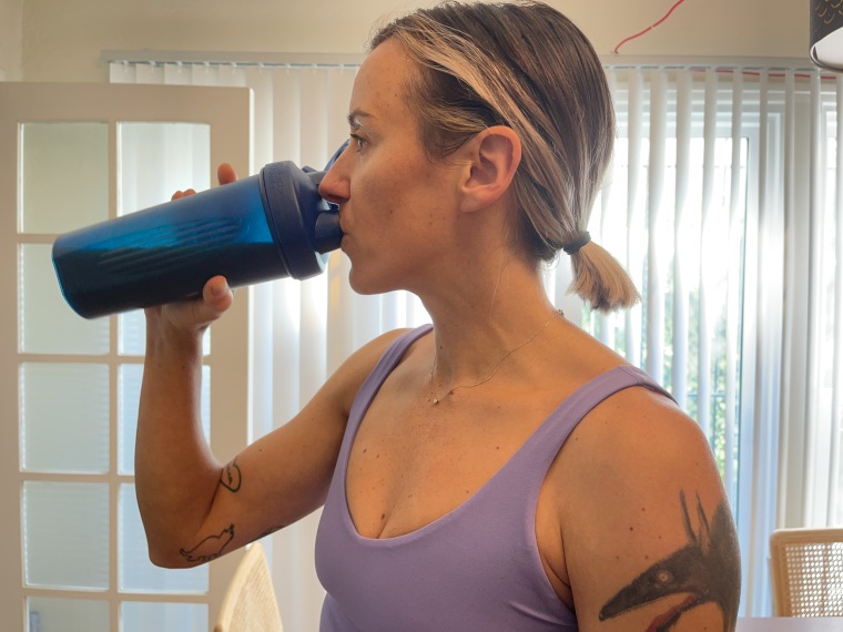 Our tester drinking a Premier Protein Powder shake.