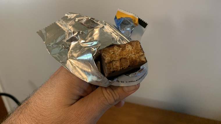 Pure Protein Protein Bar with a bite taken out