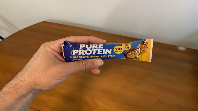 Our tester holding a Pure Protein Protein Bar