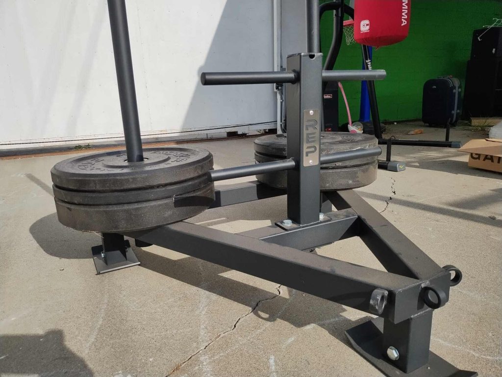 The REP Fitness Push-Pull Sled with weight plates.