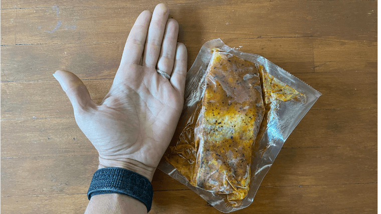 One serving size of pre-wrapped frozen salmon is about the same size as our tester's palm.