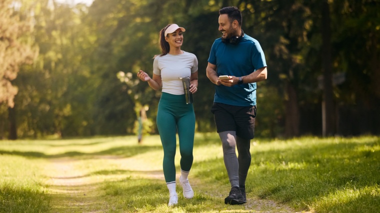 Athletic man and woman walk to prevent obesity and hypertension