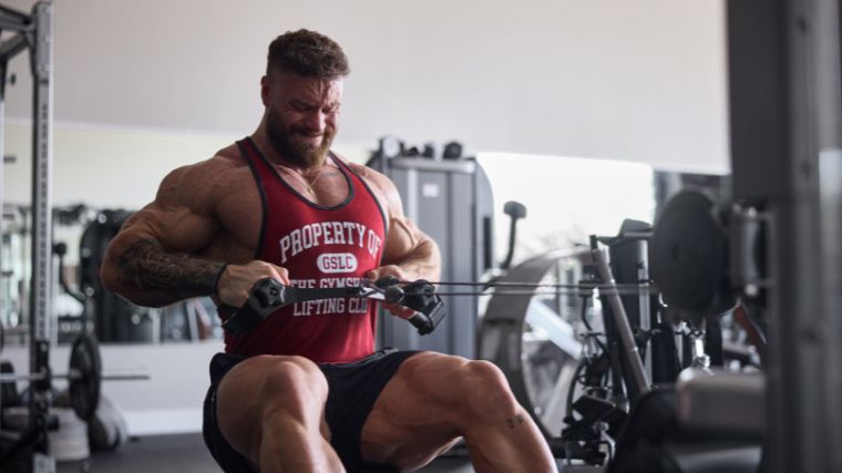 Chris Bumstead performs seated cable rows