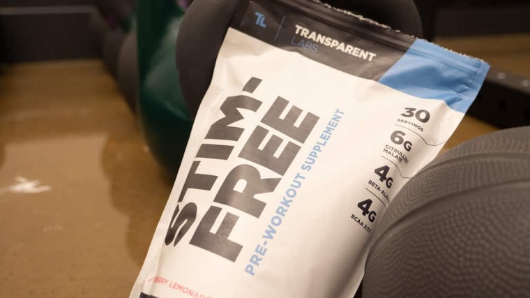 A bag of Transparent Labs Stim-Free Pre-Workout is next to a basketball