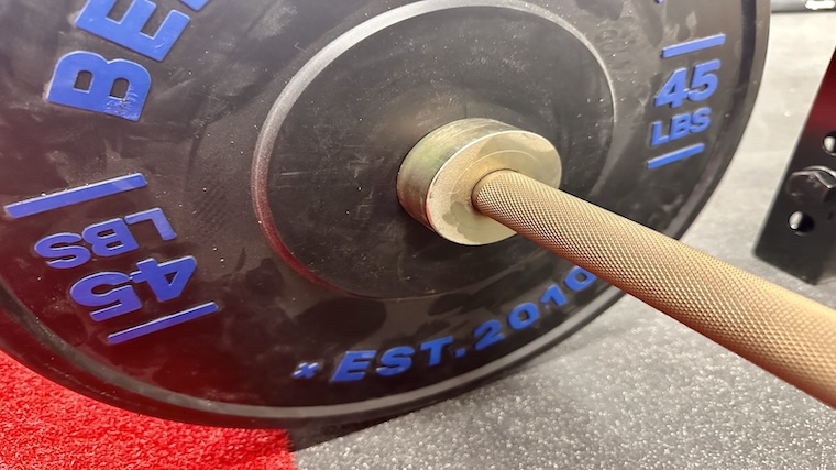 Bells of Steel Dead Bounce Conflict Bumper Plates loaded onto a barbell for deadlifts