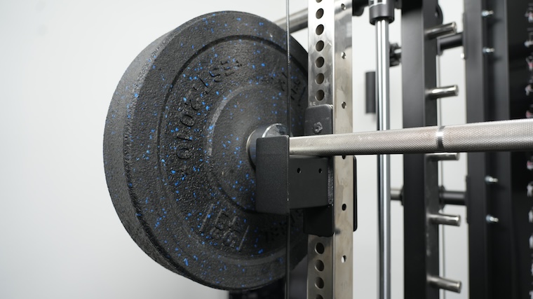 A barbell racked on the Force USA G15