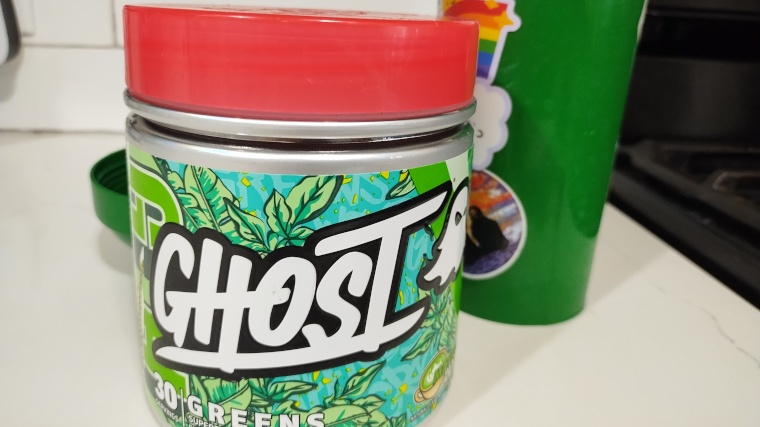 A container of Matcha Latte flavored Ghost Greens powder