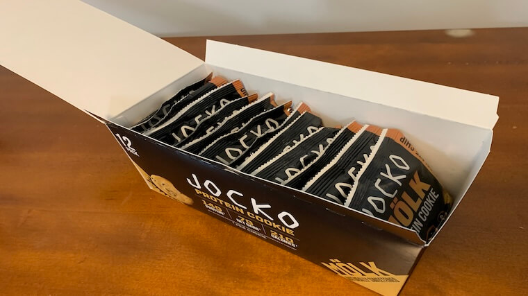 An opened case of Jocko Molk Protein Cookies