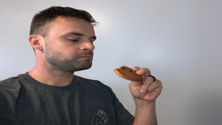 Our tester taking a bite out of a Jocko Molk Protein Cookie