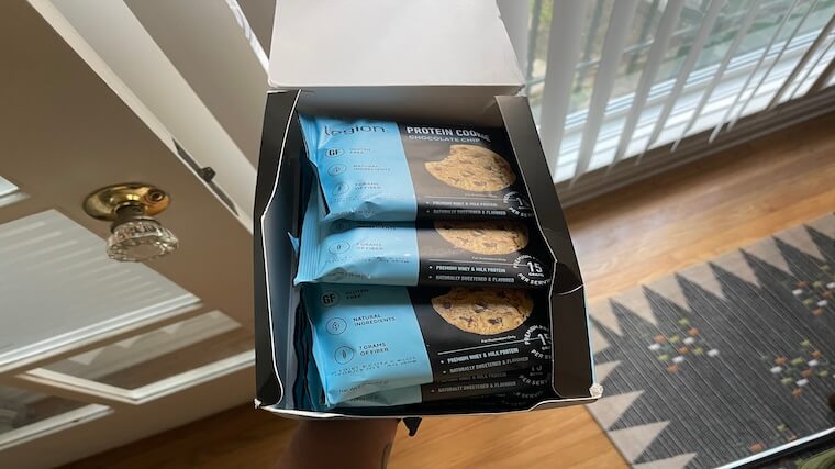 An opened box of Legion Protein Cookies