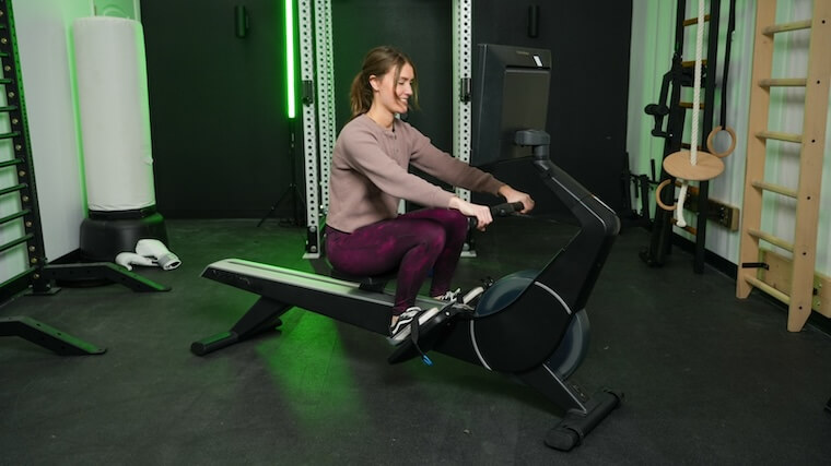 Our tester training atop a NordicTrack rowing machine