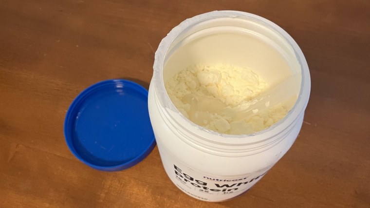 Looking into a container of Nutricost Egg White Protein Powder