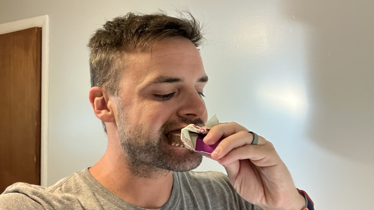 Our tester bites into a Think! Nutrition Protein Bar