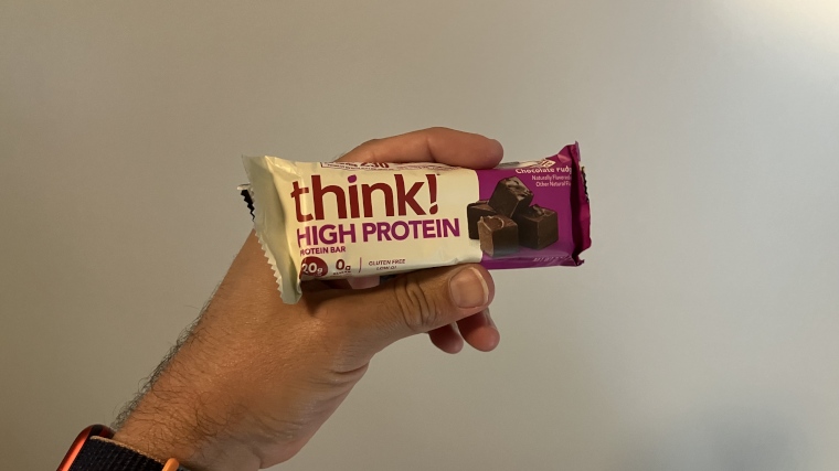 Our tester holding a wrapped Think! Nutrition Protein Bar