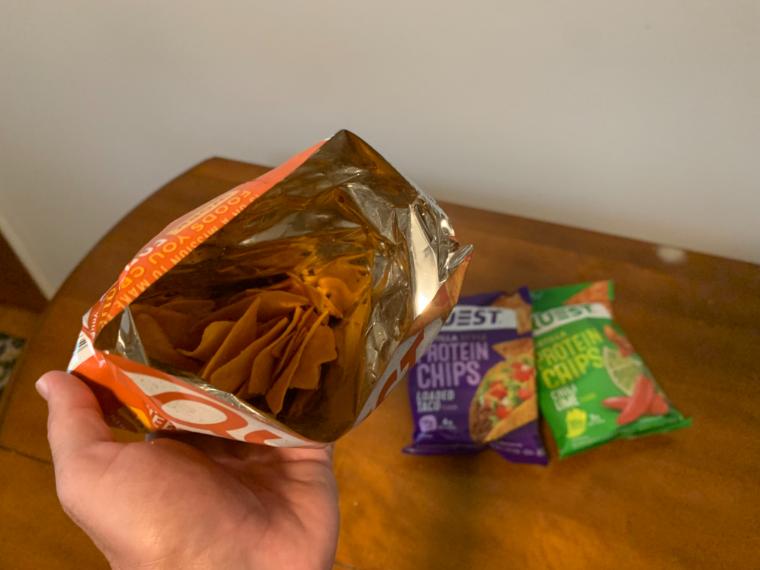 Taking a peek inside a bag of Quest Nutrition Tortilla Style Protein Chips.