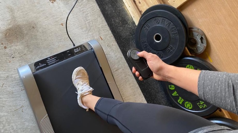 Our tester using the remote control for the Egofit Walker Pro