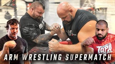 Retired strongman competitors Eddie Hall and Brian Shaw arm wrestling.