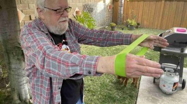 A man is shown doing strength exercises with an Iron Bull Mini Band