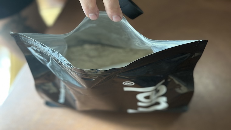 An open container of Huel Black Edition Meal Replacement