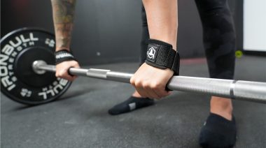 a person gripping a barbell