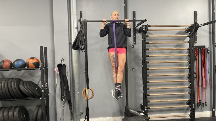 Our tester doing a Fringe Sport Band assisted pullup