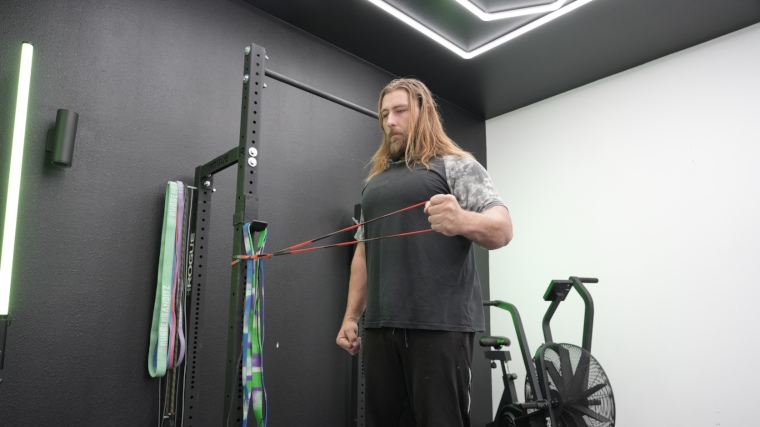 Our tester works out with the red and black Living Fit Resistance Band