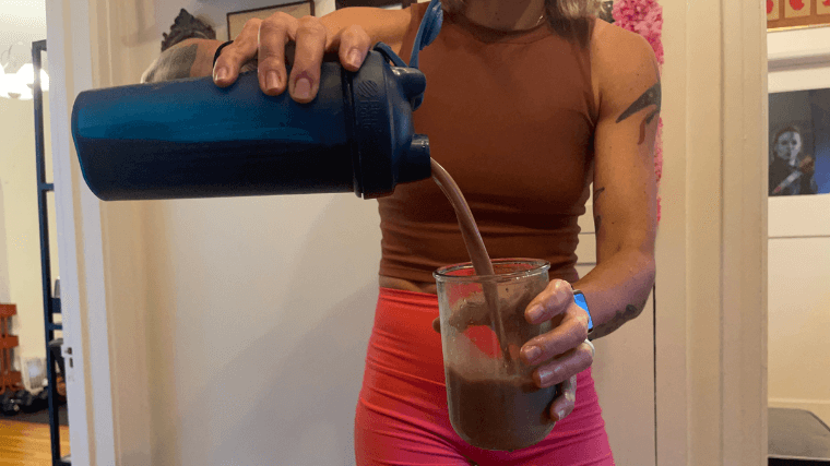 Transparent Labs Casein Protein poured from Blender bottle into a glass.