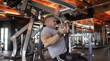 Jay Cutler performs lat pulldowns.