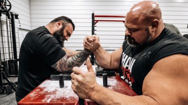 Brian Shaw arm wrestles Eddie Hall.