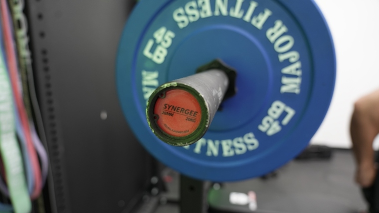 Close up of the end cap on a Synergee Games Cerakote Barbell