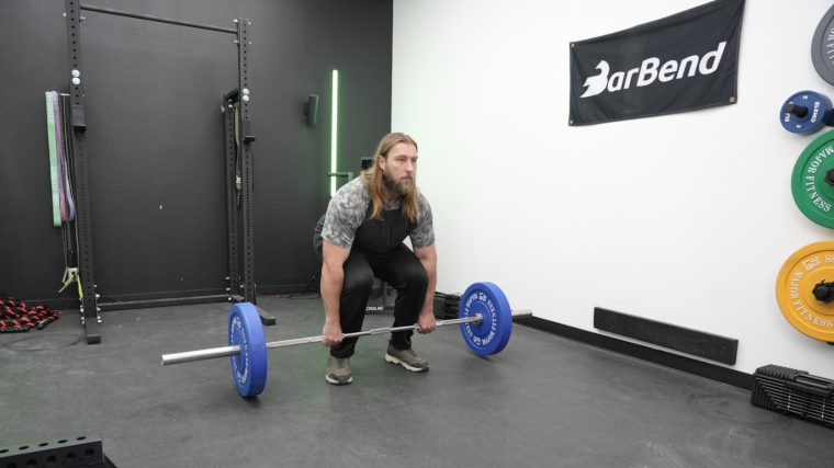 Our tester getting ready to lift a REP Fitness Double Black Diamond Bar