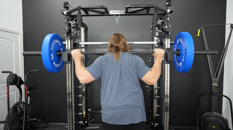 Our tester working out with the Rogue 2.0 Barbell