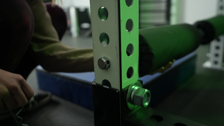 A close look at the cotter pin hole for anchoring a REP Fitness Leg Roller Attachment