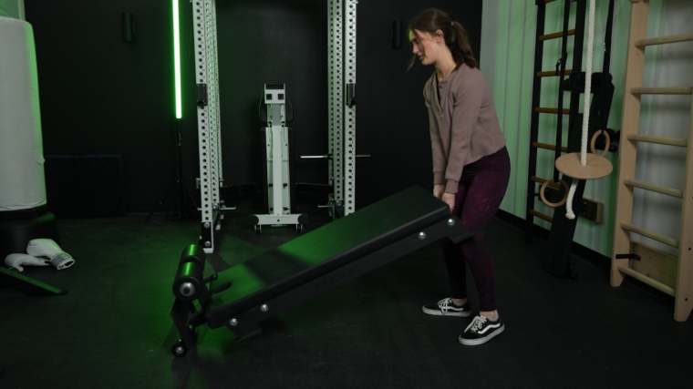 Our tester moving the Rogue Floor Glute machine