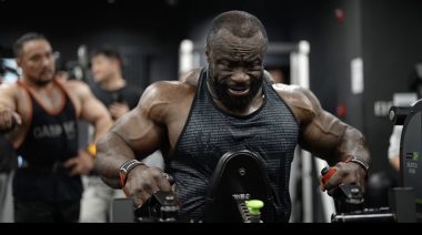 2024 Mr. Olympia Samson Dauda on a chest-supported seated row machine.