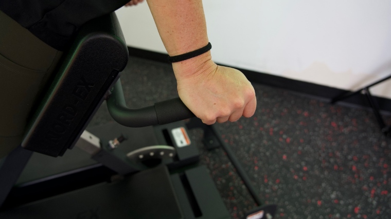 A close look at our tester's hand on the middle platform handle bar of a Shogun NORD-EX