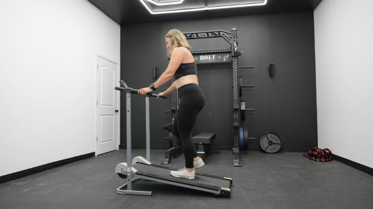 A woman does a workout on the SF-T1407 treadmill.