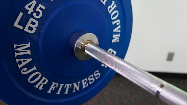 The knurling and collar on a Major Fitness Barbell Advanced