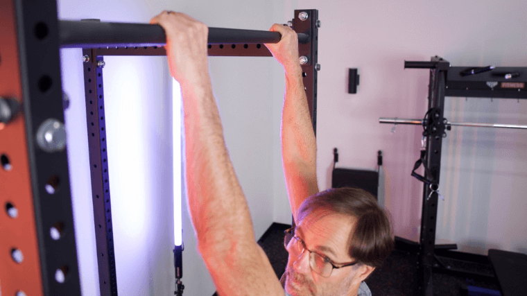 Our tester grabbing hold of the pull-up bar featured on the Titan T3 Power Rack