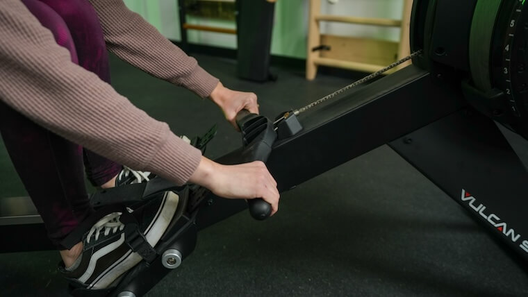 Our tester gripping the handlebar on the Vulcan Scull Rower