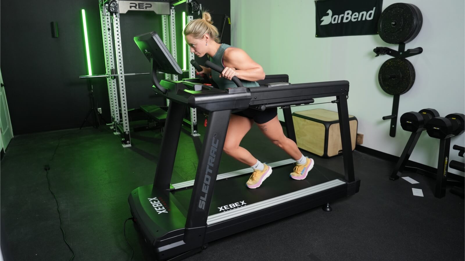 a person performing a sled push on the Xebex ST-6000 Treadmill