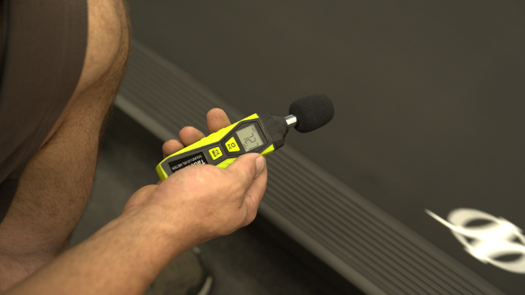 A decibel reader measures how loud the NordicTrack 1750 is.